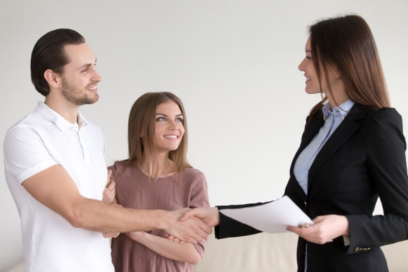 Picture of customers being assisted with a title transfer